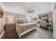 Comfortable bedroom features a ceiling fan, and a dedicated workspace with plenty of natural light at 101 Sunset Dr # 103, Sarasota, FL 34236