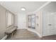 Inviting entryway featuring wood-look tile floors, neutral paint, and decorative wall art at 101 Sunset Dr # 103, Sarasota, FL 34236