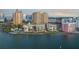 Waterfront building with manicured landscaping offers a serene living environment near downtown at 101 Sunset Dr # 103, Sarasota, FL 34236
