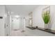 Well-maintained hallway with decor, providing a clean and welcoming transition between living spaces at 101 Sunset Dr # 103, Sarasota, FL 34236