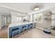 Charming eat-in kitchen featuring a large island with breakfast bar seating and modern lighting at 101 Sunset Dr # 103, Sarasota, FL 34236