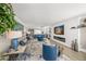 Comfortable living room with a modern fireplace and an open layout to the kitchen at 101 Sunset Dr # 103, Sarasota, FL 34236