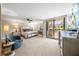 Spacious main bedroom features a private balcony and tasteful decor at 101 Sunset Dr # 103, Sarasota, FL 34236