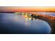 Dramatic nighttime view of bridge over the water, showcasing vibrant city lights in the distance at 101 Sunset Dr # 103, Sarasota, FL 34236