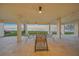Charming outdoor patio space with seating offering serene water views at 101 Sunset Dr # 103, Sarasota, FL 34236