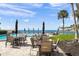 Relaxing pool area with comfortable patio seating, overlooking the beautiful bay waters at 101 Sunset Dr # 103, Sarasota, FL 34236