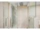 Modern shower showcasing sleek glass doors and tile, offering a spa-like experience in the updated bathroom at 101 Sunset Dr # 103, Sarasota, FL 34236