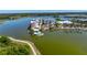 Stunning aerial view of a lakeside community with a pool, walking path, and palm tree-lined streets at 10530 Boardwalk Loop # 201, Lakewood Ranch, FL 34202