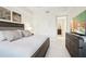 Cozy bedroom showcasing neutral tones, soft textures, and a comfortable bed for relaxation at 10530 Boardwalk Loop # 201, Lakewood Ranch, FL 34202