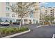 An inviting exterior view of the condo building with a convenient covered parking area at 10530 Boardwalk Loop # 201, Lakewood Ranch, FL 34202