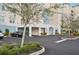An inviting exterior view of the condo building with a convenient covered parking area at 10530 Boardwalk Loop # 201, Lakewood Ranch, FL 34202