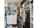 Organized walk-in closet with custom shelving and drawers for optimal storage at 10530 Boardwalk Loop # 201, Lakewood Ranch, FL 34202