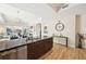 Open-concept kitchen and living space featuring stainless steel appliances, an island, and views of the water at 10530 Boardwalk Loop # 201, Lakewood Ranch, FL 34202