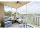 Relax on the screened lanai with comfortable seating and scenic lake views at 10530 Boardwalk Loop # 201, Lakewood Ranch, FL 34202