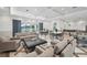 An elegant lounge area with comfortable seating, stylish decor, and access to outdoor amenities at 10530 Boardwalk Loop # 201, Lakewood Ranch, FL 34202