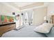 Bright main bedroom with modern decor and views of the outside at 10530 Boardwalk Loop # 201, Lakewood Ranch, FL 34202
