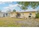 Enjoy the backyard with an outdoor deck featuring a dining set, perfect for enjoying the Florida sunshine at 108 21St Ne St, Bradenton, FL 34208
