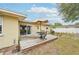 Relax on this wooden deck with outdoor seating, perfect for entertaining and grilling near the home's sliding glass doors at 108 21St Ne St, Bradenton, FL 34208