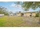 Private backyard with a storage shed and deck for outdoor relaxation and entertainment in a serene setting at 108 21St Ne St, Bradenton, FL 34208