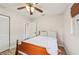 Bright bedroom with ceiling fan, modern flooring, and a window for natural light at 108 21St Ne St, Bradenton, FL 34208