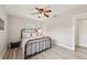 This bedroom features a ceiling fan, modern flooring, and natural light at 108 21St Ne St, Bradenton, FL 34208