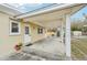 The carport offers ample covered parking with a side door and a view of the fenced backyard at 108 21St Ne St, Bradenton, FL 34208