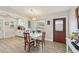 Inviting dining room with wood floors, white table, decorative lighting, and kitchen access at 108 21St Ne St, Bradenton, FL 34208