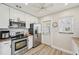 This updated kitchen has stainless steel appliances, white cabinets, and a bright, airy feel at 108 21St Ne St, Bradenton, FL 34208