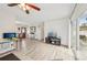 This wide open living room features an entryway, dining area, and sliding glass doors at 108 21St Ne St, Bradenton, FL 34208