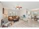Cozy living room featuring a leather sofa and easy access to the kitchen at 108 21St Ne St, Bradenton, FL 34208
