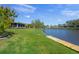 The large backyard offers beautiful water views and a private dock for boating at 1208 Angela Maria Rd, Sarasota, FL 34243