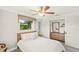 Cozy bedroom with a wooden headboard, lots of natural light, and modern furnishings at 1208 Angela Maria Rd, Sarasota, FL 34243