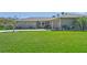 Well-maintained lawn leading up to a charming single-story home at 1208 Angela Maria Rd, Sarasota, FL 34243