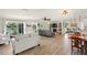 Spacious open-concept living room with lake views and stylish furnishings at 1208 Angela Maria Rd, Sarasota, FL 34243