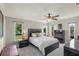 Main bedroom boasts neutral tones, black accents, and views of the backyard waterway at 1208 Angela Maria Rd, Sarasota, FL 34243