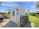 Cozy shed with wood pile and well maintained landscaping at 1208 Angela Maria Rd, Sarasota, FL 34243