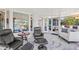 Cozy sunroom with comfortable seating, a stylish rug, and access to the outdoors at 1208 Angela Maria Rd, Sarasota, FL 34243