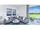 Bright living room with sliding glass doors to the outdoor patio at 15112 Cuzcorro Ct, Nokomis, FL 34275