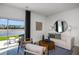 Bright living room with sliding glass doors and backyard lake view at 15124 Cuzcorro Ct, Nokomis, FL 34275