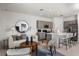 Stylish living room with modern furnishings and open layout to the kitchen at 15124 Cuzcorro Ct, Nokomis, FL 34275