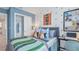 Vibrant bedroom showcasing stylish decor, natural light, and a closet offering comfort and style at 15128 Cuzcorro Ct, Nokomis, FL 34275