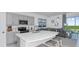 Stylish kitchen with an island that features modern stainless steel appliances, and ample counter space at 15128 Cuzcorro Ct, Nokomis, FL 34275