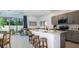 Modern kitchen with an island, stainless steel appliances, and open floorplan at 15132 Cuzcorro Ct, Nokomis, FL 34275