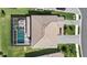 Aerial view of home with a screened-in pool, tile roof, and well-kept landscaping at 16455 Whale Grey Pl, Bradenton, FL 34211