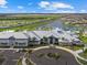 Extensive community center surrounded by landscaping, parking, and lakefront views at 16455 Whale Grey Pl, Bradenton, FL 34211