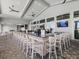 Clubhouse bar area with TVs, bar stools, and a variety of beverages on display at 16455 Whale Grey Pl, Bradenton, FL 34211