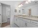 Spacious bathroom featuring a double vanity, granite counters and plenty of storage at 16455 Whale Grey Pl, Bradenton, FL 34211