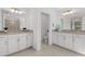 Elegant bathroom featuring a double vanity with granite countertops and a separate toilet room for added privacy at 16455 Whale Grey Pl, Bradenton, FL 34211
