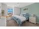 Inviting bedroom with a window seat, decorative wall art, and comfortable bed at 16455 Whale Grey Pl, Bradenton, FL 34211