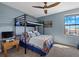 Playful bedroom with bunk bed, sports decor and a window with lots of light at 16455 Whale Grey Pl, Bradenton, FL 34211
